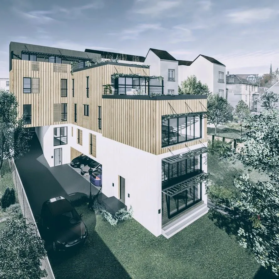 L'immeuble vu depuis le jardin : volumes en gradins, bardage bois et terrasses successives