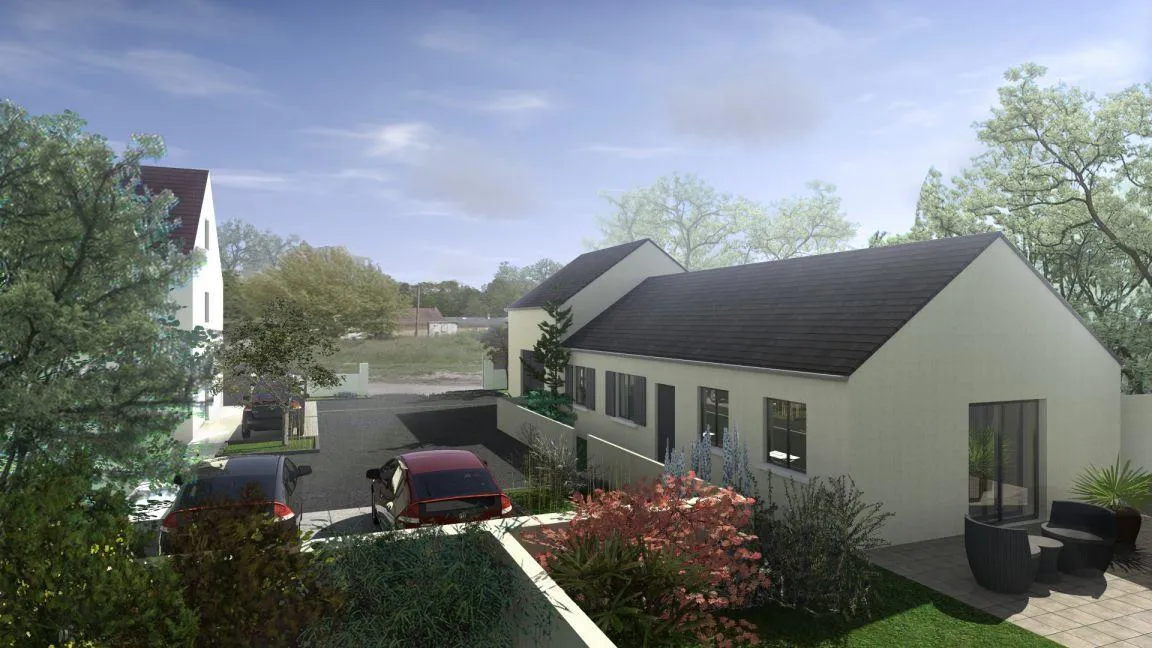 Le bâtiment reconstruit vu depuis le jardin, avec la maison existante conservée